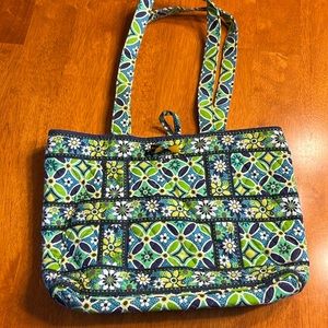 Green multicolor, daisy print, Vera Bradley, purse, and wallet.